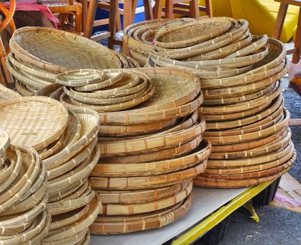 Handcrafted wicker baskets and trays at an outdoor market