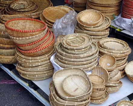 Handcrafted wicker baskets and trays at an outdoor market