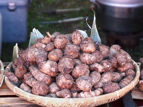 A market vendor sells taro roots, a popular vegetable in Taiwan