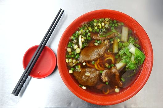 Braised beef in broth with noodles and chives is a popular dish in Taiwan