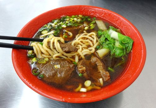 Braised beef in broth with noodles and chives is a popular dish in Taiwan