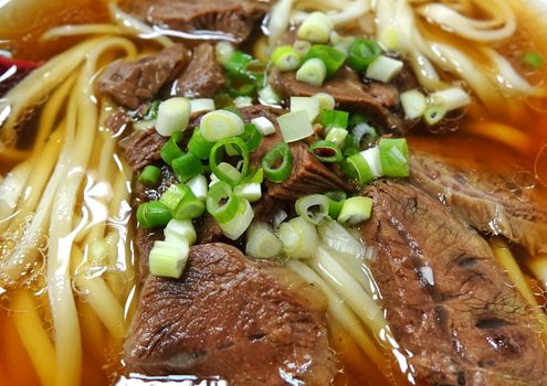 Braised beef in broth with noodles and chives is a popular dish in Taiwan