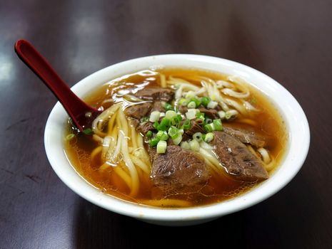 Braised beef in broth with noodles and chives is a popular dish in Taiwan
