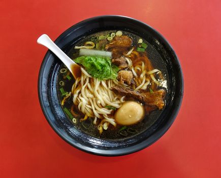 Braised beef in broth with noodles and chives is a popular dish in Taiwan