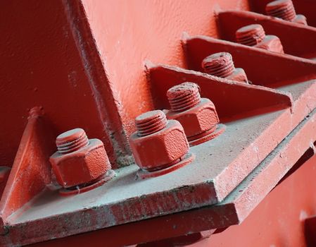 Heavy duty bolts and nuts hold a girder in place