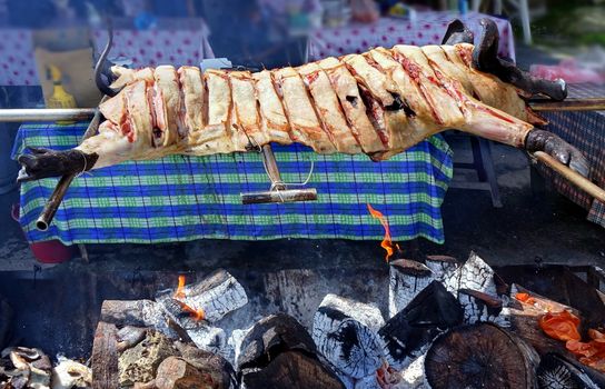 Traditional black-haired pig barbecue in Taiwan mountain village
