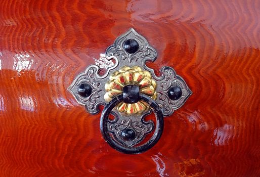 Silver color and brass color bronze fittings on a Japanese wooden Taiku drum

