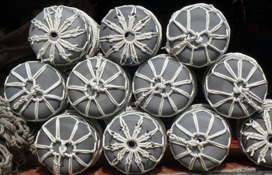 A store for boat supplies sells large fishing buoys with ropes
