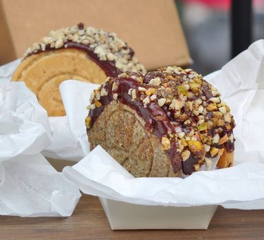 Delicious cake with chocolate glaze and nuts