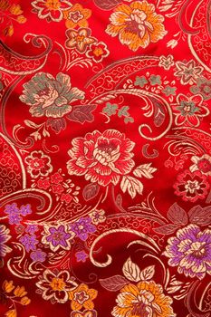 Traditional Chinese floral print pattern on red fabric