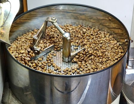 A local coffee shop prepares freshly roasted coffee beans

