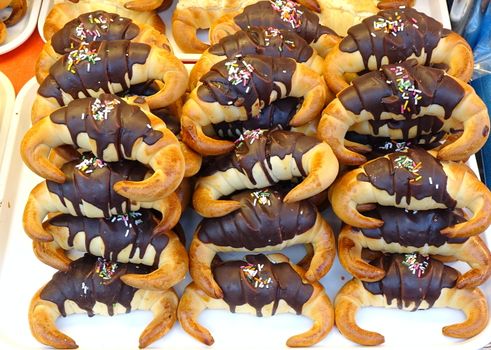 A market stall sells freshly baked Taiwan style croissants with chocolate