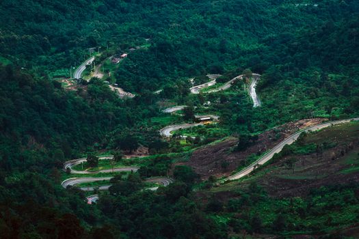 Beautiful Road summer landscape in the mountains with the sunset