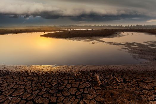 thunder storm sky Rain clouds Cracked dry land without wate