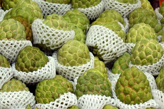 Fresh custard apples, a tropical fruit, are being sold at the market