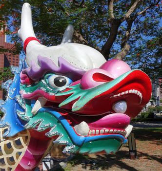 The traditional figurehead in the shape of a dragon decorates the front end of the dragon boats.
