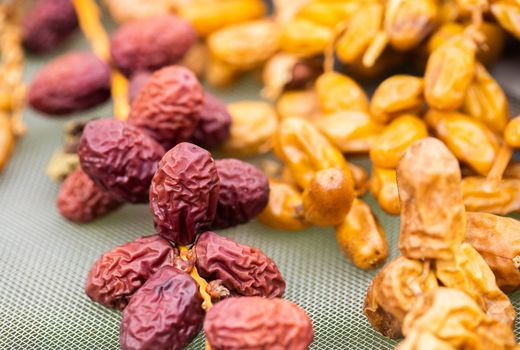 Dates fruit in a wooden bowl closeup 