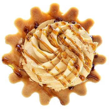 Tartlet cake with cream and caramel, top view isolated on a white background.