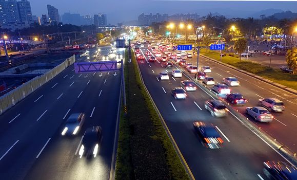 Dense traffic at evening rush hour on a main street in Kaohsiung, Taiwan
