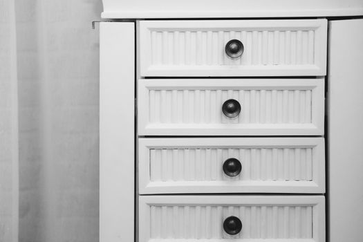 white wooden drawer cabinet in living room interior