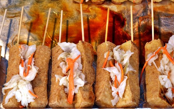 Stinky fermented tofu with pickled cabbage and hot sauce is popular in Taiwan