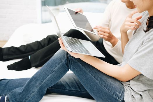 man woman friends using computer tablet. startup teamwork team working together at home