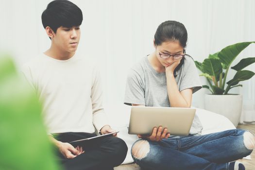 man woman friends using computer tablet. startup teamwork team working together at home