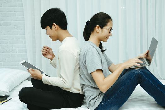 man woman friends using computer tablet. startup teamwork team working together at home