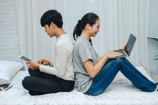 man woman friends using computer tablet. startup teamwork team working together at home