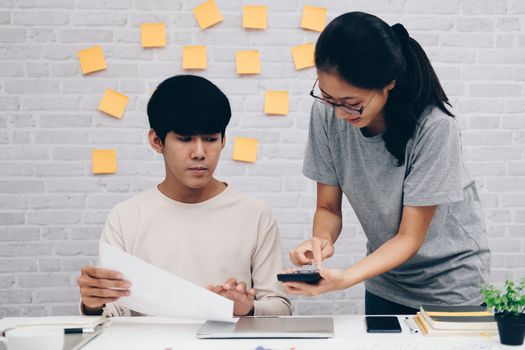 man woman colleagues analyzing data on computer startup teamwork coworking team working at home office