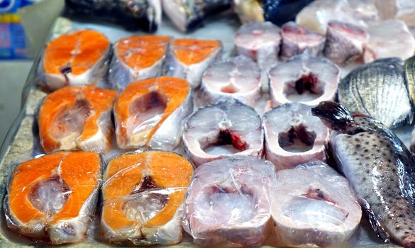 Fish steaks are sold at an outdoor market