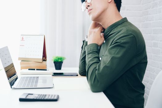 freelancer man businessman feeling tired exhausted from neck pain