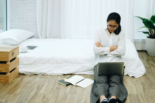 asian woman using computer. freelancer work remotely at home. leisure lifestyle