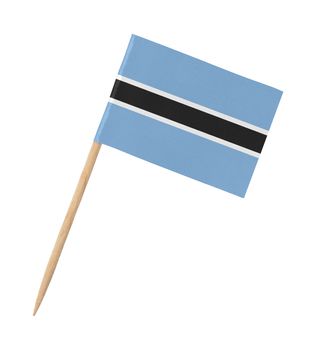 Small paper flag of Botswana on wooden stick, isolated on white
