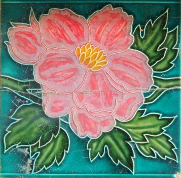 Old Chinese ceramic tile with flower motif