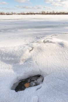 Detail of a hole in the ice on the frozen Dnieper river in Kiev, Ukraine