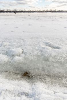 Detail of a crack in the ice on the frozen Dnieper river in Kiev, Ukraine