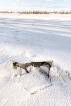 Detail of a hole in the ice on the frozen Dnieper river in Kiev, Ukraine