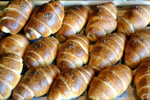 Freshly baked bread buns in a tray