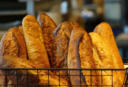 Freshly baked loaves of French bread in a basket
