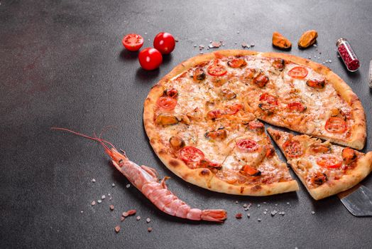 Seafood Italian pizza with shrimp, squid, mussels, fresh herbs and mozzarella on a
dark background. Tasty sliced pizza with seafood and tomato on a concrete background