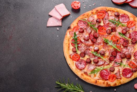 Pepperoni Pizza with Mozzarella cheese, salami, ham. Italian pizza on a dark background