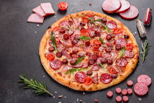 Pepperoni Pizza with Mozzarella cheese, salami, ham. Italian pizza on a dark background