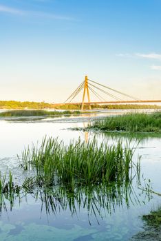 A view of the Moskovsky  bridge over the Dnieper river in Kiev, Ukraine, during a blue summer evening