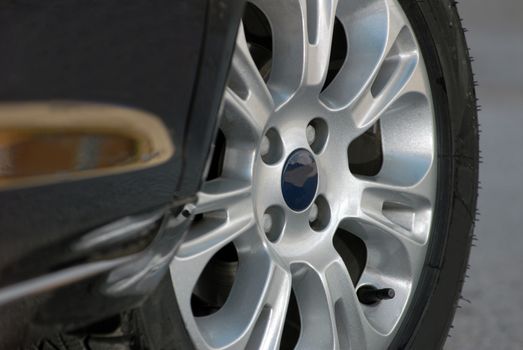 tire and alloy wheel on this high performance sports car - fragment