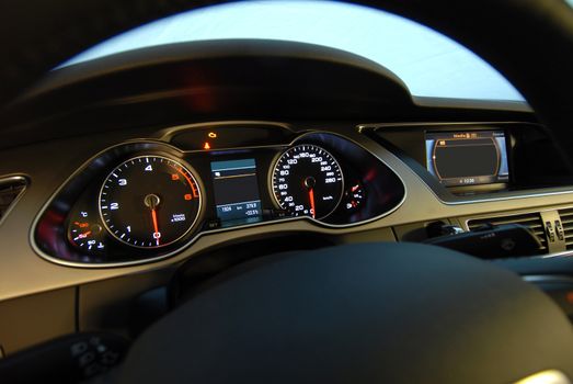 Modern car illuminated dashboard closeup