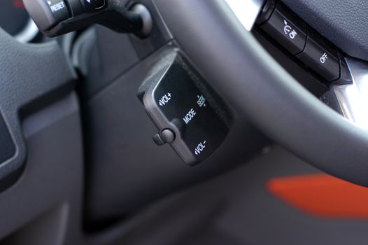 Detail of a luxury car interior, audio control