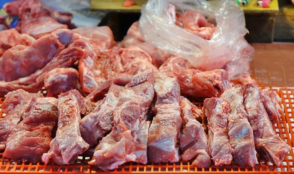 A local market in Taiwan sells slabs of fresh raw pork
