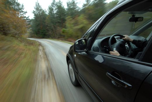 Off-road car driving madly fast in the country