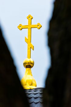 A detail of a golden cross of Kievo Pechersky Lavra Monastery in Kiev.